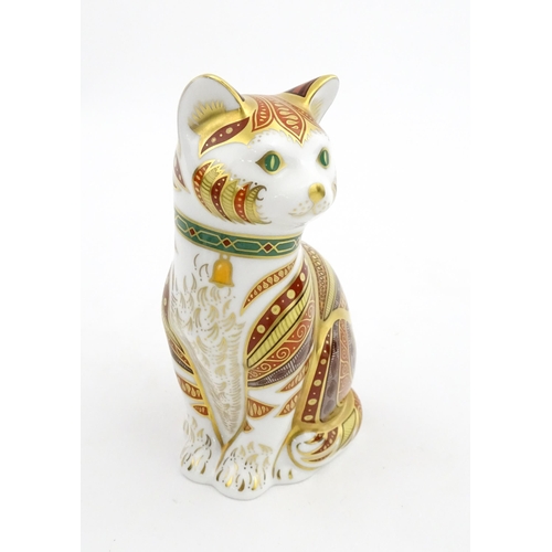 105 - A Royal Crown Derby paperweight modelled as a seated cat, Marmaduke. Marked under, limited edition. ... 