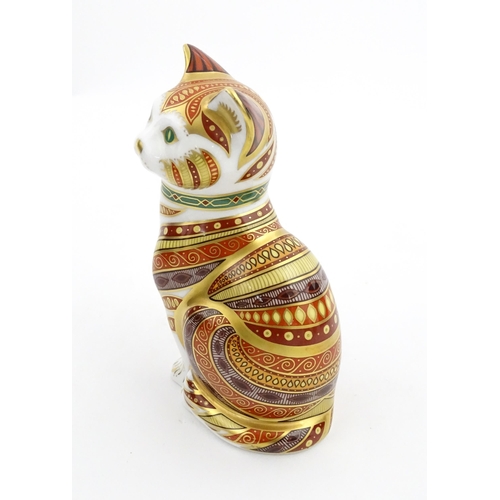 105 - A Royal Crown Derby paperweight modelled as a seated cat, Marmaduke. Marked under, limited edition. ... 