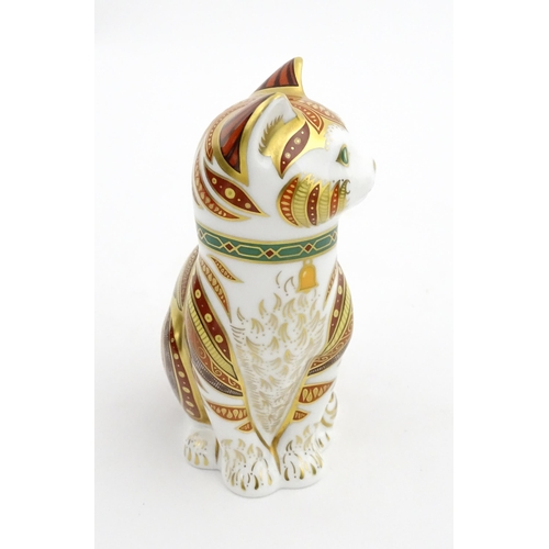 105 - A Royal Crown Derby paperweight modelled as a seated cat, Marmaduke. Marked under, limited edition. ... 