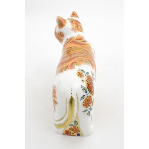 106 - A Royal Crown Derby paperweight modelled as a cat, Sugar Collectors Guild Cat. Marked under. Boxed. ... 