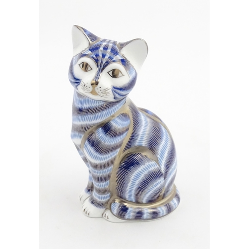 109 - A Royal Crown Derby paperweight modelled as a seated cat, Silver tabby Cat. Marked under. Boxed. App... 