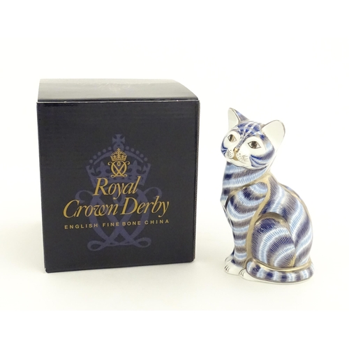 109 - A Royal Crown Derby paperweight modelled as a seated cat, Silver tabby Cat. Marked under. Boxed. App... 