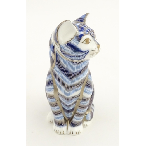 109 - A Royal Crown Derby paperweight modelled as a seated cat, Silver tabby Cat. Marked under. Boxed. App... 