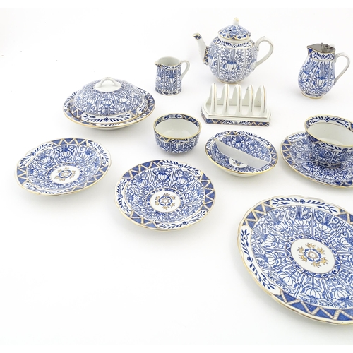 163 - A Harley Jones breakfast set for two in the Wilton Lily pattern comprising teapot, jug, sugar bowl, ... 