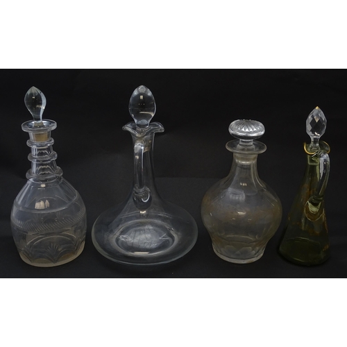 185 - Various 19thC and later glass decanters and ewers. The tallest approx 11