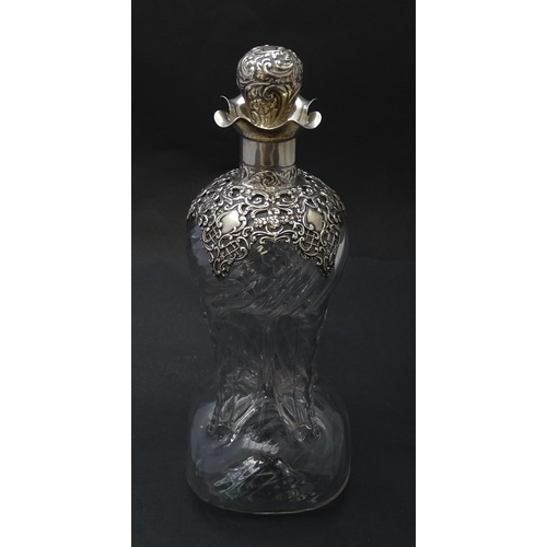 186 - A Victorian glass glug glug decanter with pinch detail, the silver mounts hallmarked  Birmingham 190... 