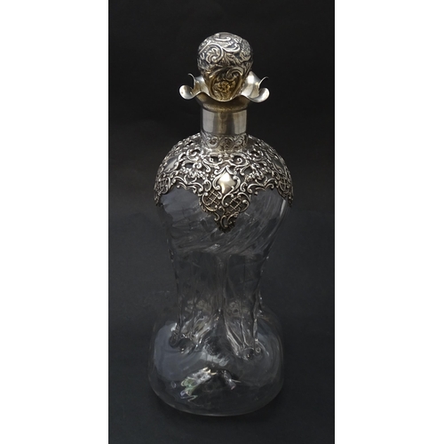 186 - A Victorian glass glug glug decanter with pinch detail, the silver mounts hallmarked  Birmingham 190... 