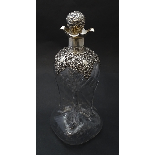 186 - A Victorian glass glug glug decanter with pinch detail, the silver mounts hallmarked  Birmingham 190... 