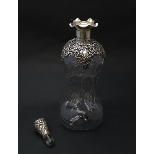 186 - A Victorian glass glug glug decanter with pinch detail, the silver mounts hallmarked  Birmingham 190... 