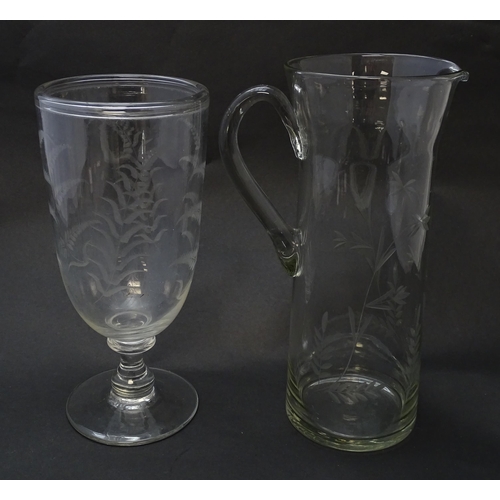 188 - A pedestal glass celery vase with engraved fern decoration together with a glass jug with loop handl... 