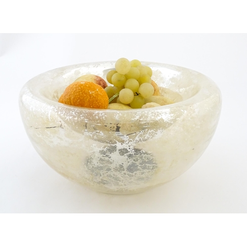 193 - A late 20thC Mercury glass style bowl together with a quantity of painted faux alabaster fruit. The ... 