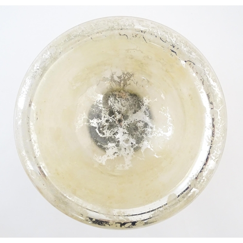 193 - A late 20thC Mercury glass style bowl together with a quantity of painted faux alabaster fruit. The ... 