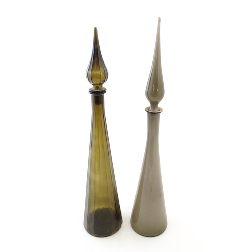 233 - Two tall Empoli style glass decanters of elongated tapering form. Largest approx. 25 3/4