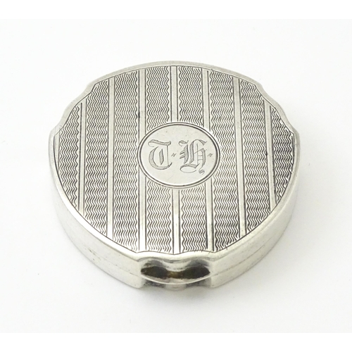 242 - A silver compact with engine turned decoration hallmarked Birmingham 1931, maker Adie Bros Ltd. Appr... 