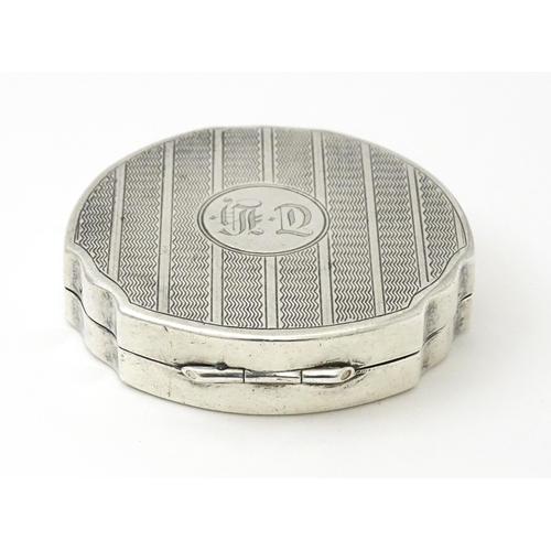 242 - A silver compact with engine turned decoration hallmarked Birmingham 1931, maker Adie Bros Ltd. Appr... 