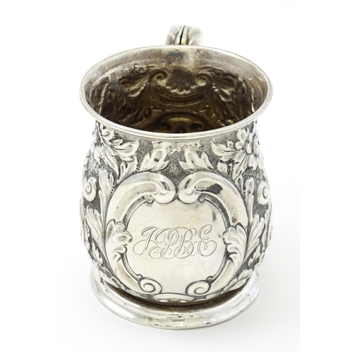 260 - A silver christening mug with floral and acanthus decoration. Hallmarked Birmingham 1908 maker The A... 