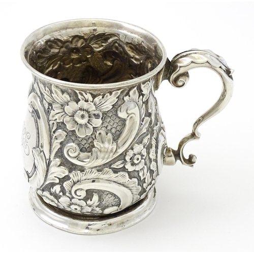 260 - A silver christening mug with floral and acanthus decoration. Hallmarked Birmingham 1908 maker The A... 