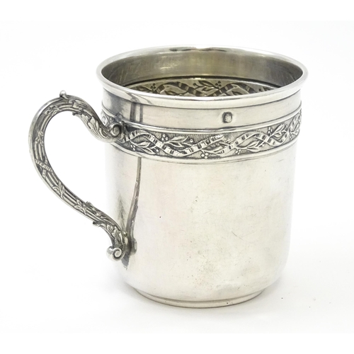 406 - A French silver cup and saucer with banded decoration, maker Gustave Veyrat. Cup approx. 2 1/2