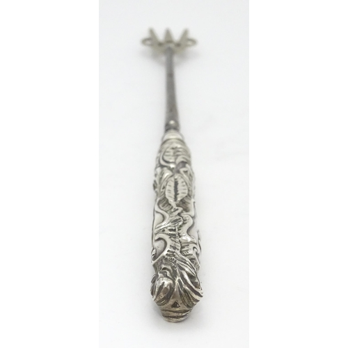 418 - A Victorian silver handled bread fork with embossed decoration, hallmarked Birmingham 1892, maker Ad... 