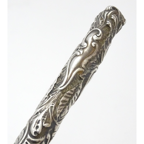 418 - A Victorian silver handled bread fork with embossed decoration, hallmarked Birmingham 1892, maker Ad... 