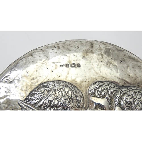 421 - A silver hand mirror with cherub decoration hallmarked Birmingham 1904, maker Mitchell Bosley & Co. ... 