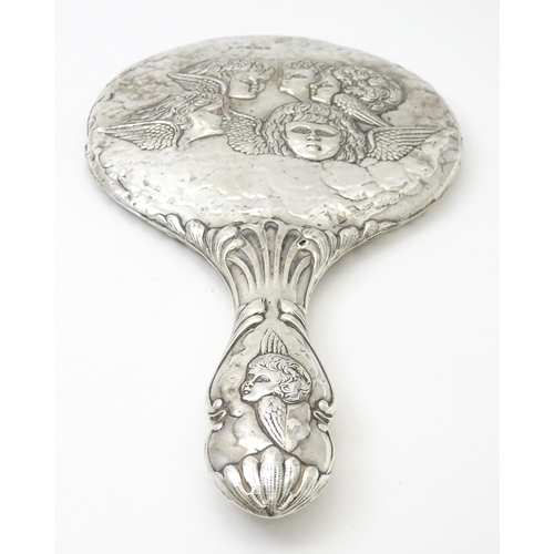 421 - A silver hand mirror with cherub decoration hallmarked Birmingham 1904, maker Mitchell Bosley & Co. ... 