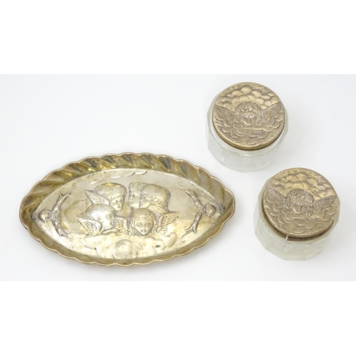 263 - A silver pin dish with embossed cherub detail, hallmarked Chester 1896, maker James Deakin & Sons. T... 