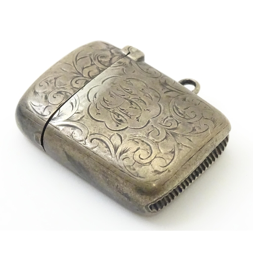 332 - A Victorian silver vesta case with engraved decoration. Hallmarked Birmingham 1897 maker Colen Hewer... 