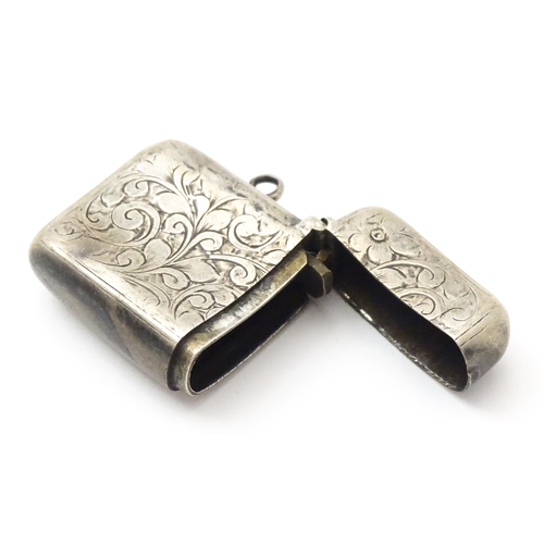 332 - A Victorian silver vesta case with engraved decoration. Hallmarked Birmingham 1897 maker Colen Hewer... 