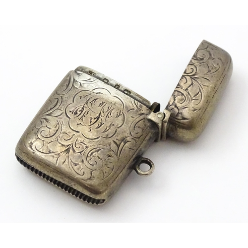 332 - A Victorian silver vesta case with engraved decoration. Hallmarked Birmingham 1897 maker Colen Hewer... 