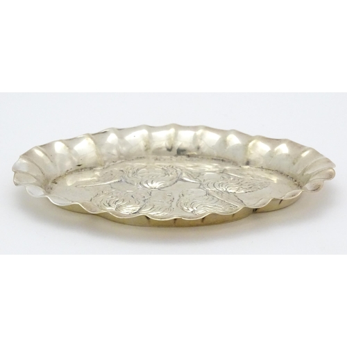 397 - A silver pin dish with embossed angel decoration hallmarked Birmingham 1904, maker Henry Matthews. A... 