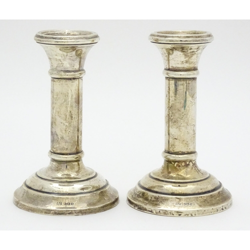 486 - A pair of silver candlesticks hallmarked Birmingham 1926, maker Jones & Crompton. Approx. 4 3/4