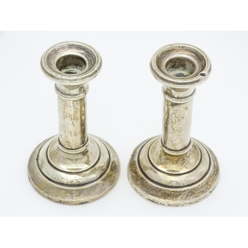 486 - A pair of silver candlesticks hallmarked Birmingham 1926, maker Jones & Crompton. Approx. 4 3/4