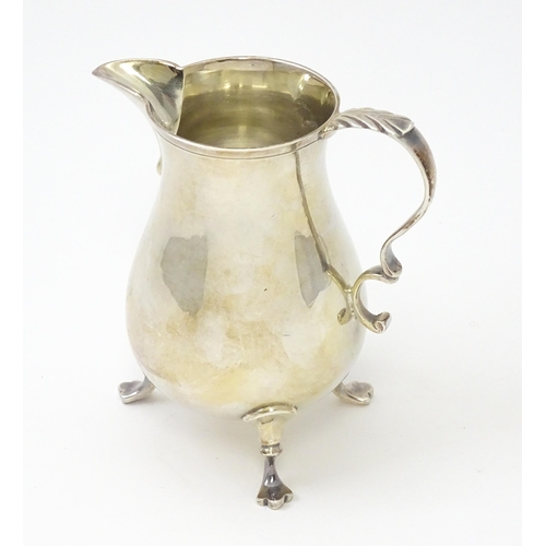 273 - A 20thC silver cream jug hallmarked Birmingham 1980 maker Bert Gordon. Approx 3 3/4