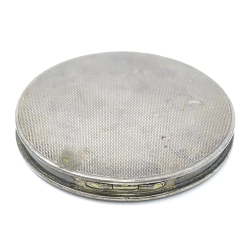 292 - A silver compact with engine turned decoration and mirror to lid.   Hallmarked Birmingham 1962 , mak... 