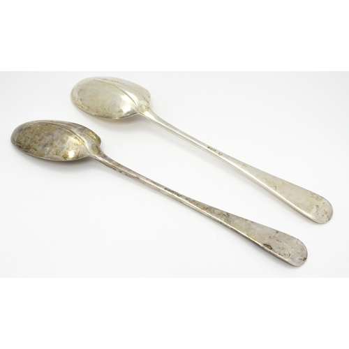 299 - A pair of silver basting / stuffing spoons hallmarked London 1928 . maker Francis Higgins & Son Ltd.... 