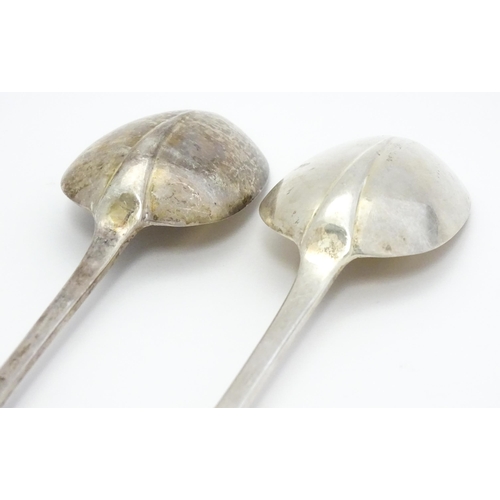 299 - A pair of silver basting / stuffing spoons hallmarked London 1928 . maker Francis Higgins & Son Ltd.... 