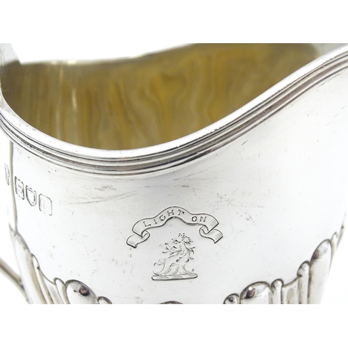 348 - A silver cream jug with engraved armorial titled ' Light on '  hallmarked London 1898 maker Charles ... 