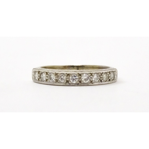 547 - An 18ct white gold half eternity ring set with nine diamonds. Ring size approx. P 1/2