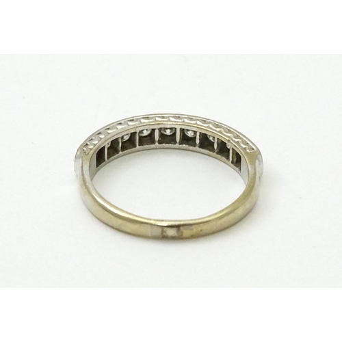 547 - An 18ct white gold half eternity ring set with nine diamonds. Ring size approx. P 1/2