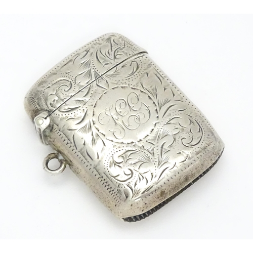 241 - A silver vesta case with acanthus scroll decoration hallmarked Birmingham 1902, maker Joseph Gloster... 