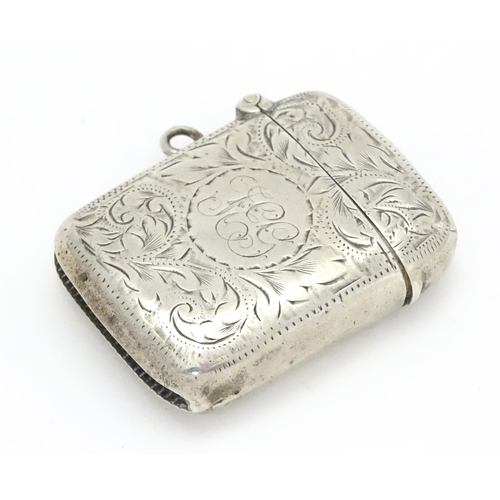 241 - A silver vesta case with acanthus scroll decoration hallmarked Birmingham 1902, maker Joseph Gloster... 