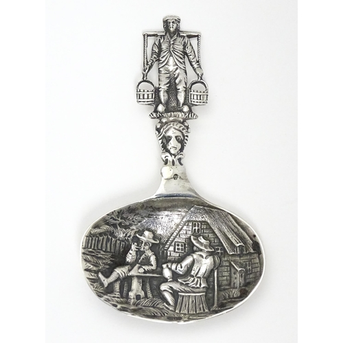 245 - A Continental silver caddy spoon with Dutch style detail. Approx. 3