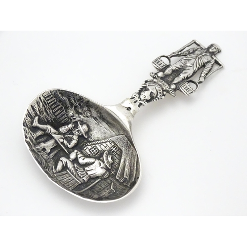 245 - A Continental silver caddy spoon with Dutch style detail. Approx. 3