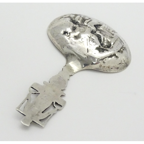 245 - A Continental silver caddy spoon with Dutch style detail. Approx. 3