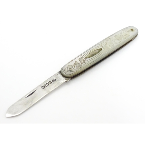 253 - A small silver folding fruit knife with mother of pearl handle having engraved decoration, hallmarke... 