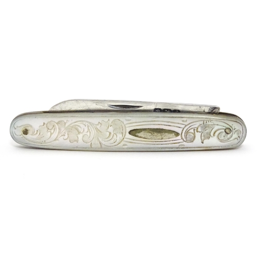 253 - A small silver folding fruit knife with mother of pearl handle having engraved decoration, hallmarke... 