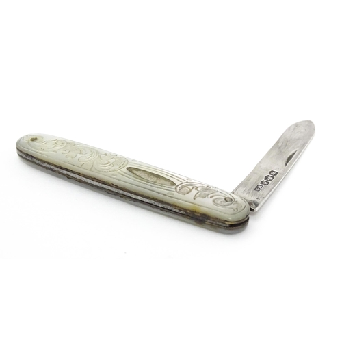 253 - A small silver folding fruit knife with mother of pearl handle having engraved decoration, hallmarke... 