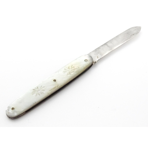 253 - A small silver folding fruit knife with mother of pearl handle having engraved decoration, hallmarke... 