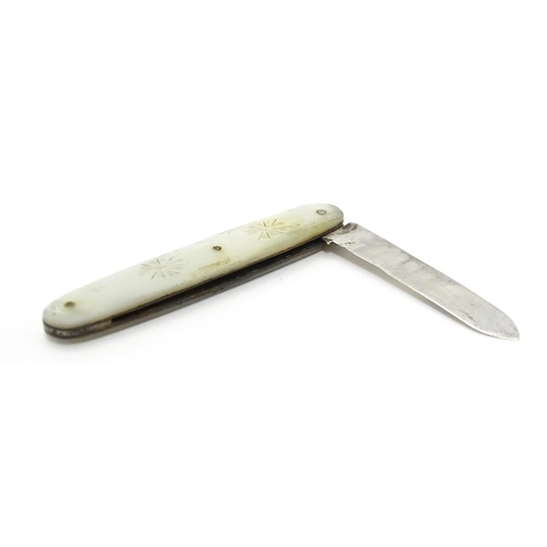 253 - A small silver folding fruit knife with mother of pearl handle having engraved decoration, hallmarke... 